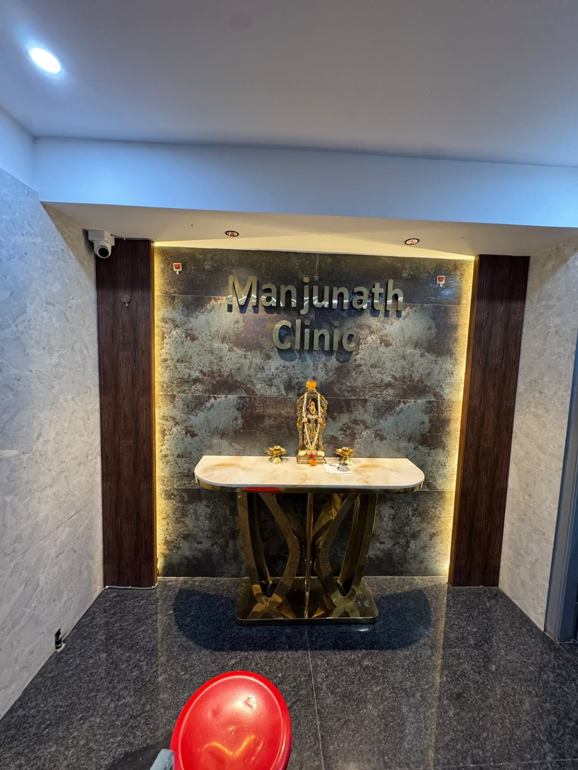 Manjunath Clinic entrance and reception feature wall